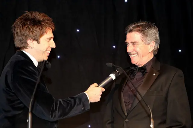 On stage, interviewed at an awards evening