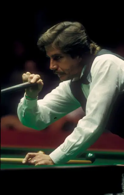 Cliff standing at the table, cue in hand