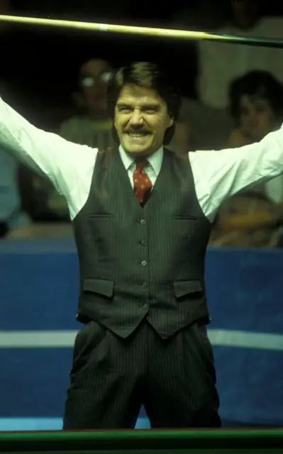 Cliff celebrating, arms raised